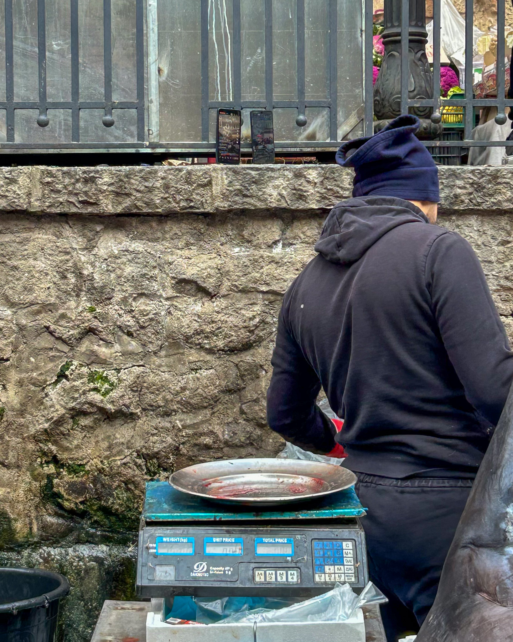 Smart phones recording the fish market in Catania and streaming on TikTok live