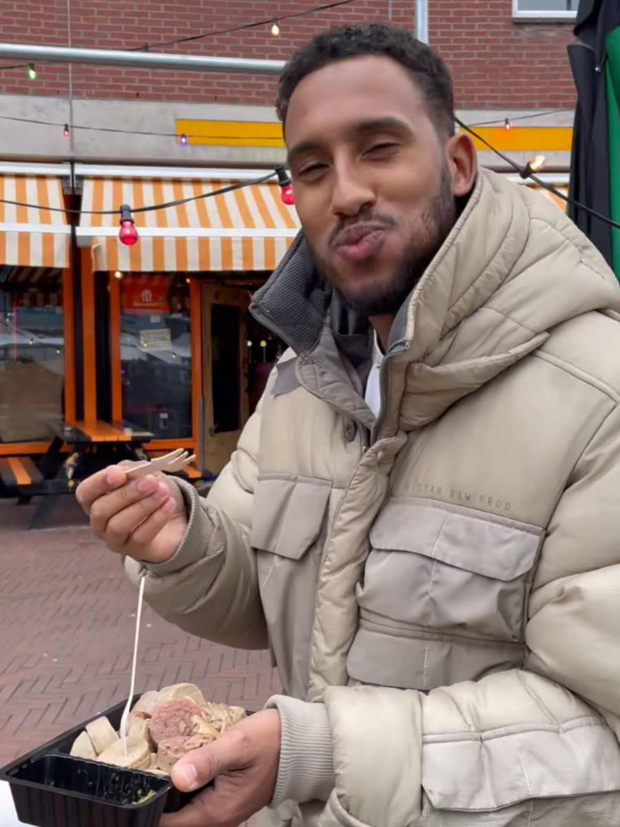 Nana Asare eating at the market